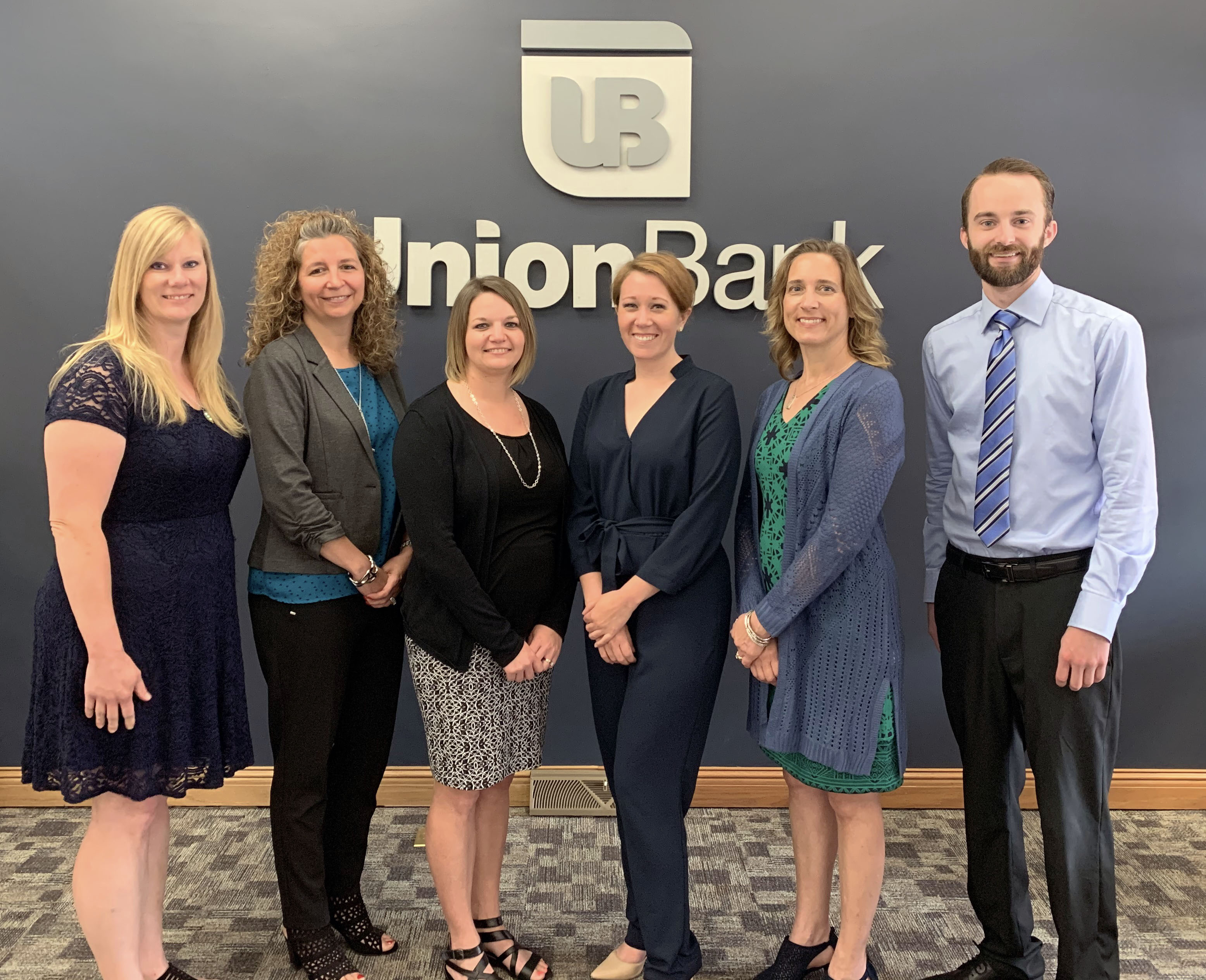 Image Description.  Union Bank announces six employee promotions.  Pictured from left to right are: Stephanie Brummette, Sandra Collison, Stephanie Joseph, Lindsay Farrell, Christine Fortier, and Derek Dickinson.